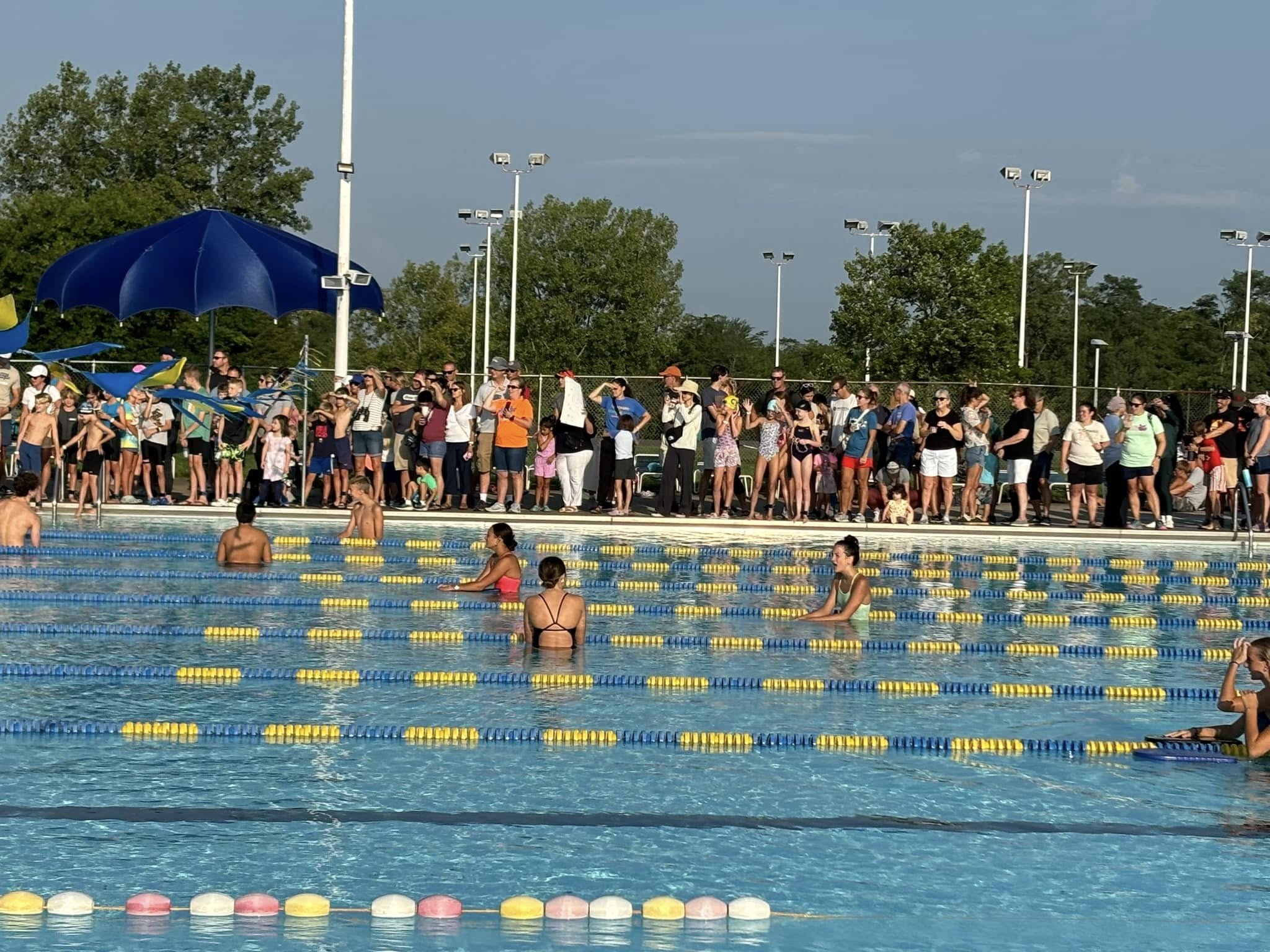 Crowd next to Olympic swimming pool
